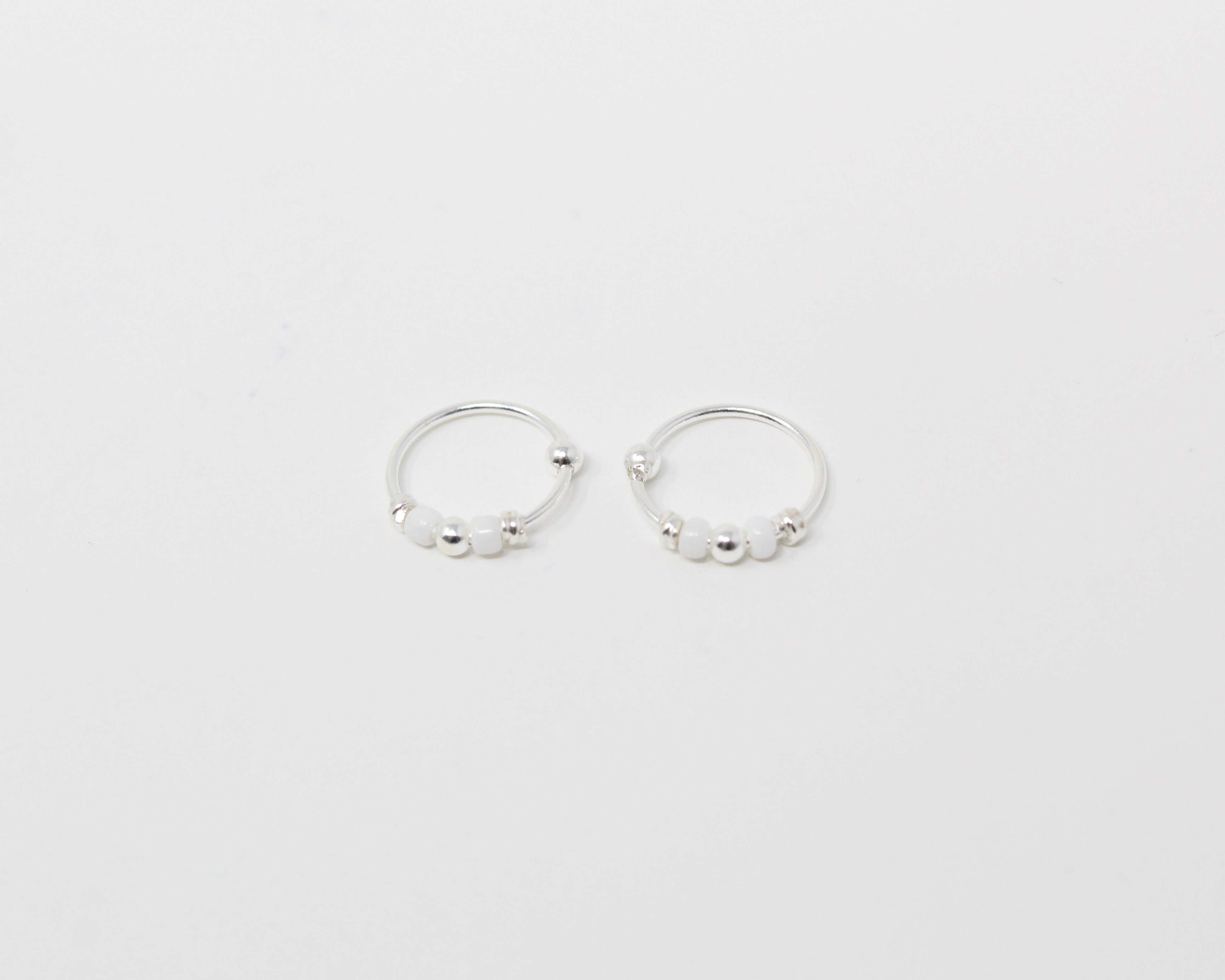 MARRA., anneaux argent sterling et billes.